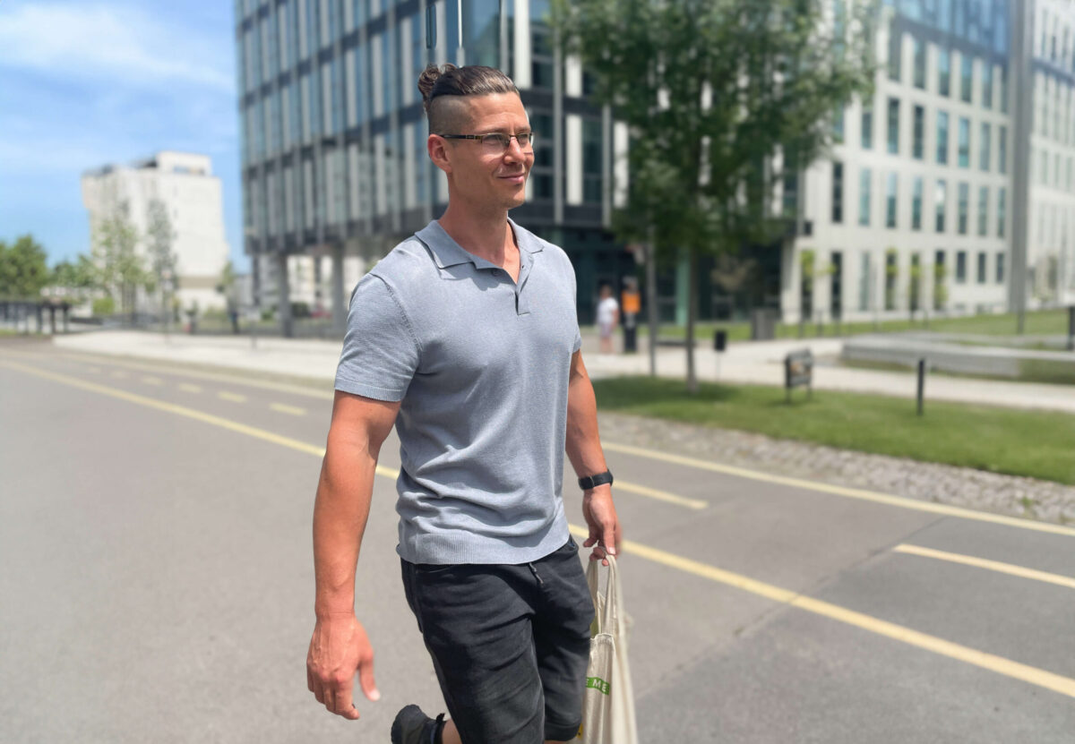 Ricky walking with groceries