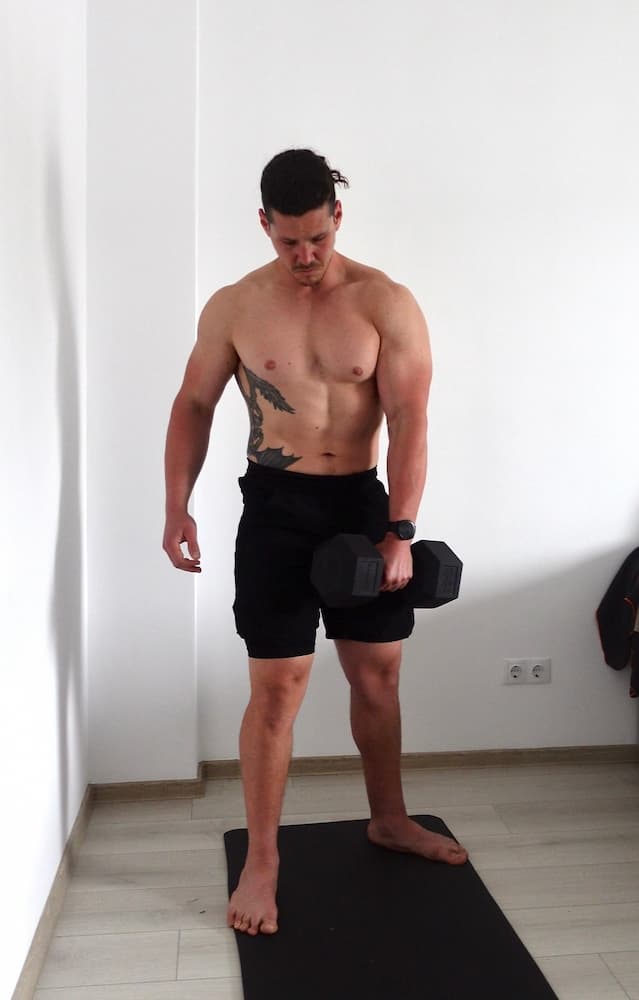 Ricky training at home with a dumbell